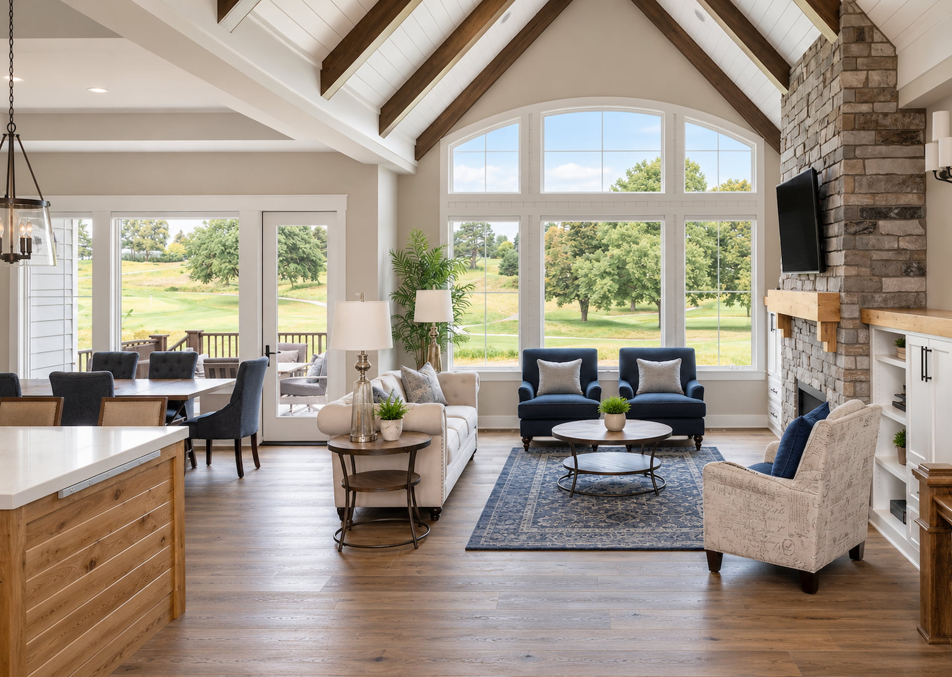 New build open concept great room with exposed wood beams, vaulted ceiling, stone fireplace, and hardwood floors, Sioux Falls South Dakota